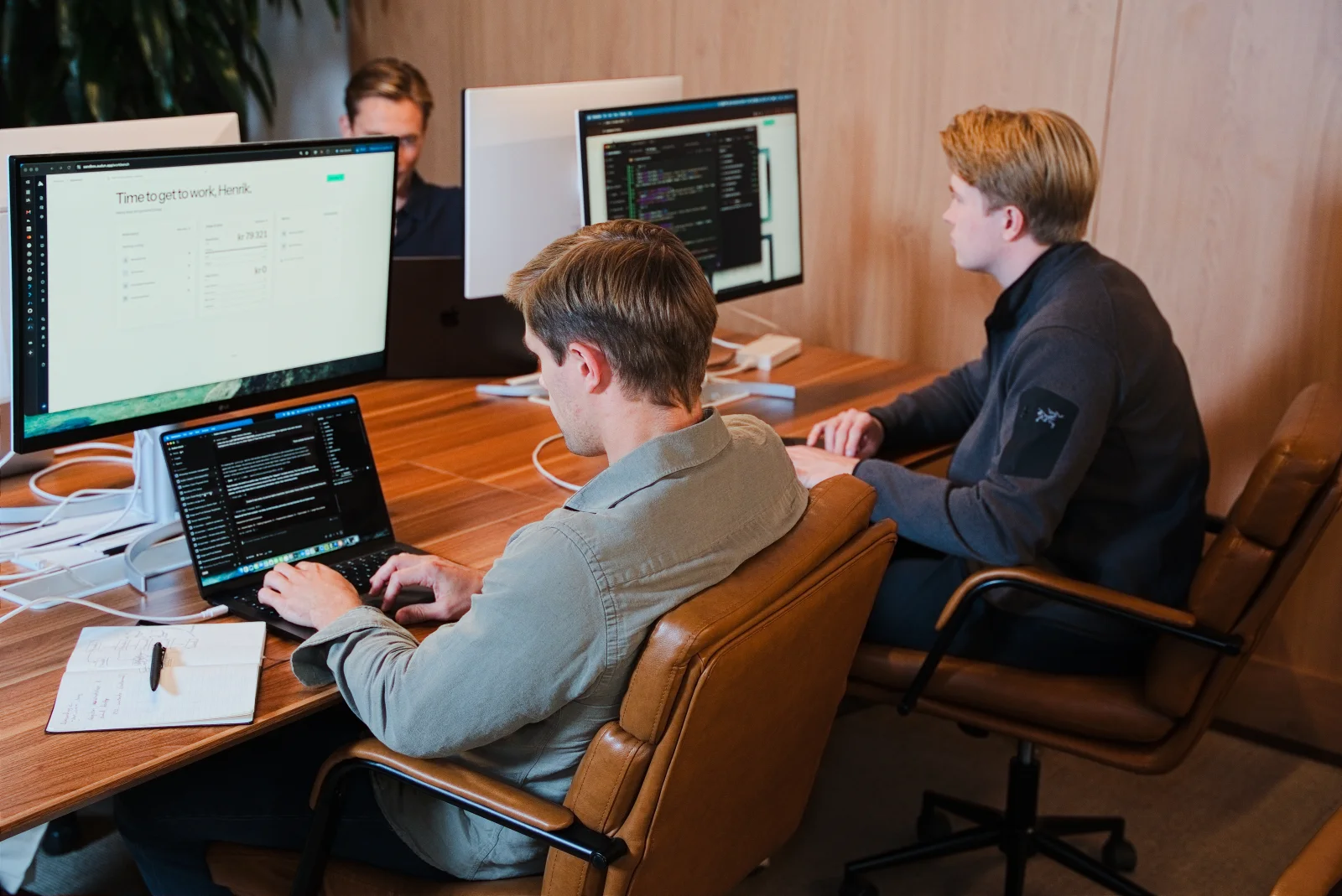 Audun colleagues working on the product at their desks.