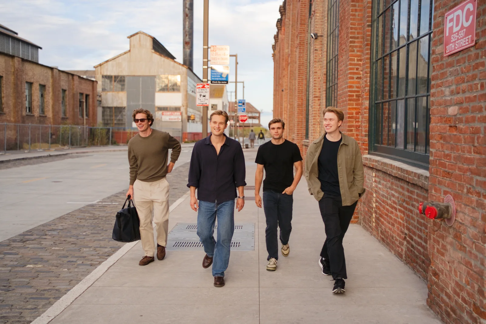 Four members of the Audun team walking together outside.